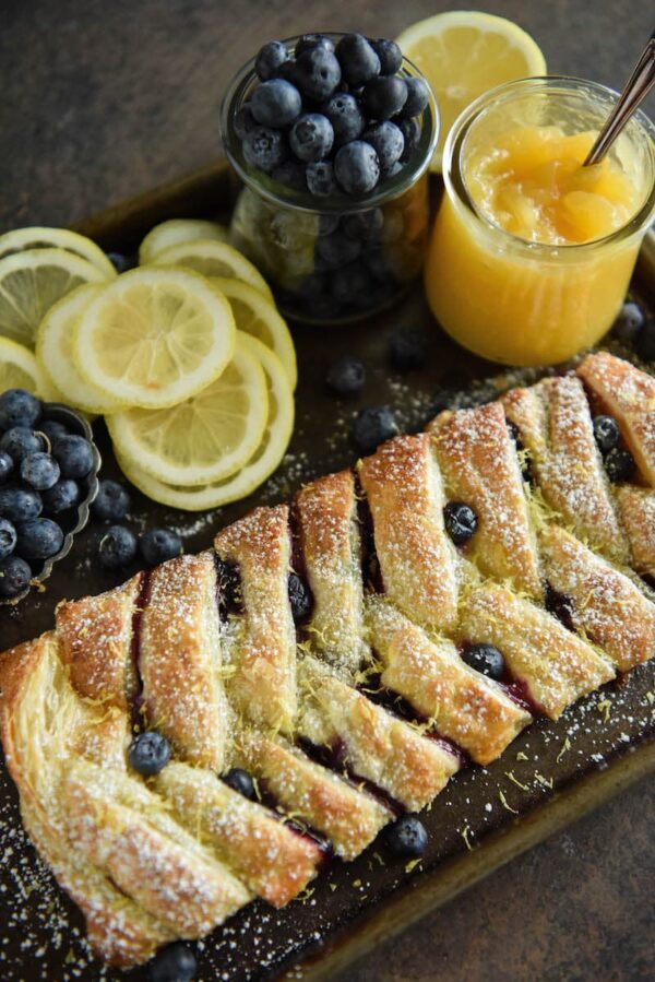 This flaky Blueberry Lemon Braid is filled with cream cheese, lemon curd and blueberries to create an amazing dessert. It is also perfect with coffee for breakfast.