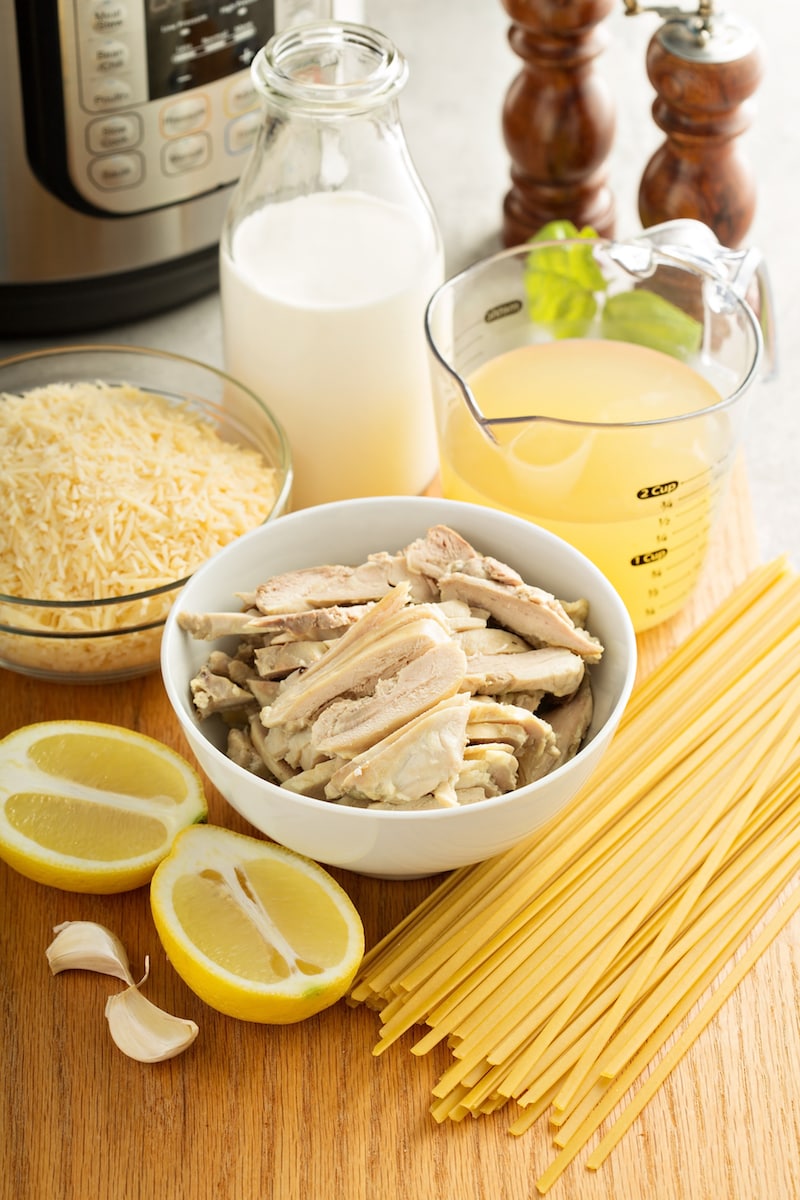 Cream, parmesan, garlic, lemon, chicken, broth, and dry pasta.