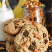 A Stack of Three Chunky Monkey Cookies with a Fourth One Propped Up Against the Stack