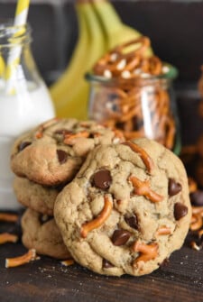 A Stack of Three Chunky Monkey Cookies with a Fourth One Propped Up Against the Stack