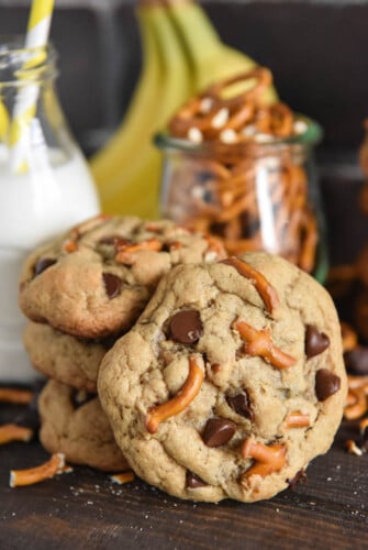 A Stack of Three Chunky Monkey Cookies with a Fourth One Propped Up Against the Stack
