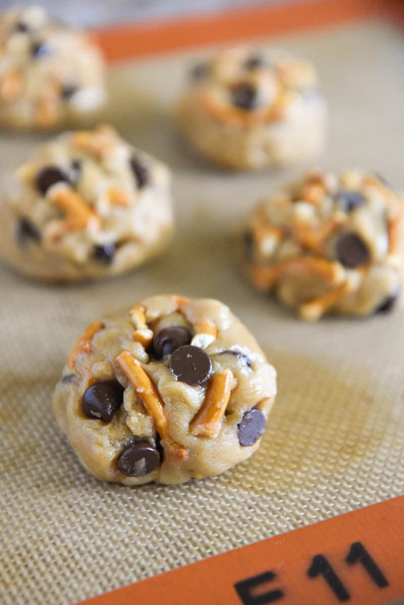 Balls of Sweet and Salty Chocolate Chip Cookie Dough on a Silpat Liner