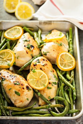 Sheet Pan Roasted Lemon Herb Chicken & Green Beans: our favorite weeknight dinner can be prepped ahead for a super easy one-pan dinner or made fresh in minutes! #dinner #sheetpan #chicken #onepandinner