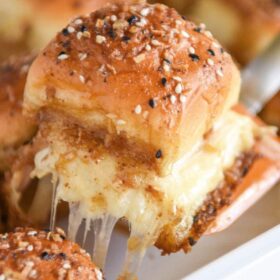 Cheesy Turkey Sliders: these melted turkey and havarti sliders are covered in a buttery sauce and served warm out of the oven for the ultimate game day treat! #turkey #appetizer