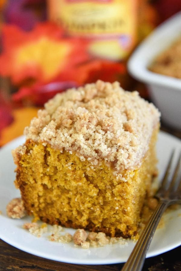 Pumpkin Sour Cream Coffee Cake: an extra moist pumpkin spice cake (made from scratch) is topped with an amazing cinnamon crumb topping! Serve it with coffee for breakfast or for dessert! #Pumpkin #CoffeeCake #Dessert #Cake