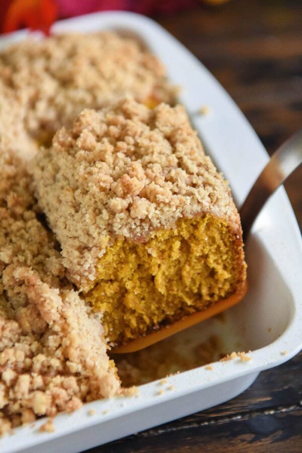 Pumpkin Sour Cream Coffee Cake: an extra moist pumpkin spice cake (made from scratch) is topped with an amazing cinnamon crumb topping! Serve it with coffee for breakfast or for dessert! #Pumpkin #CoffeeCake #Dessert #Cake