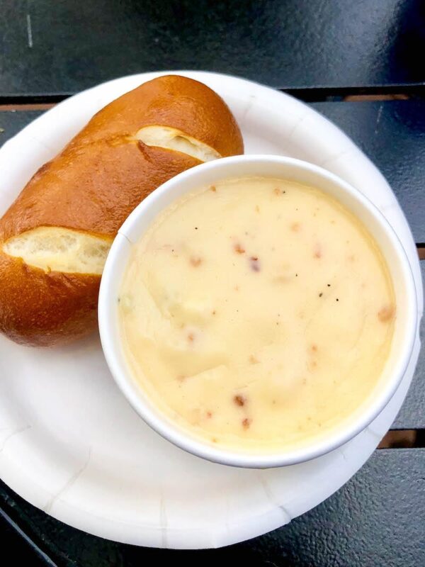 Canadian Cheddar Cheese and Bacon Soup served with a Pretzel Roll at Epcot Food & Wine Festival 