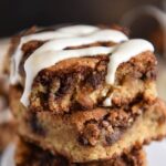 Cinnamon Roll Blondies: super soft blondies are swirled with a sweet cinnamon brown sugar filling and served warm with a drizzle of cream cheese icing! #Blondies #Dessert #CinnamonRoll