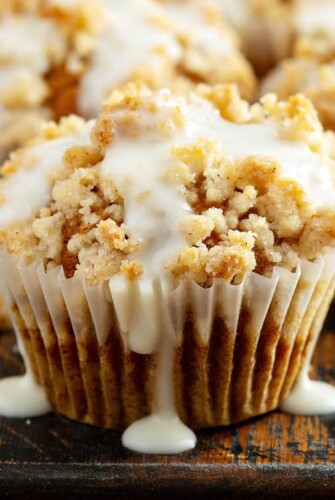 Pumpkin Streusel Muffins: these made from scratch, moist pumpkin spice muffins, are topped with a golden cinnamon streusel and drizzled with cream cheese icing! #pumpkin #muffins #fallrecipes