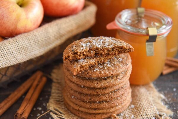 Apple Cider Cookies in a stack with two broken in half so you can see inside. 