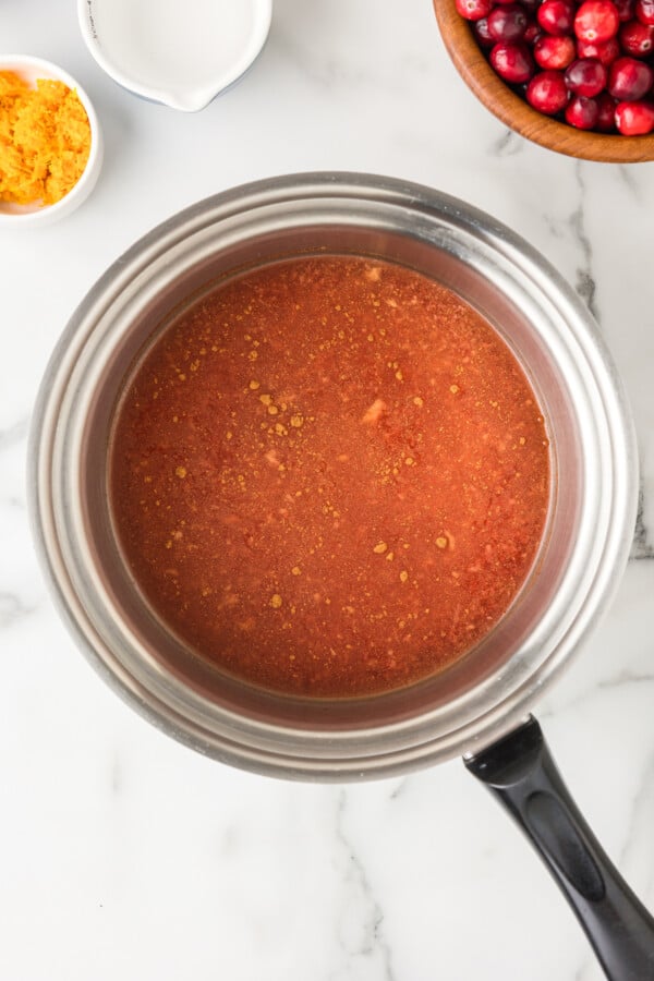 Boiling the sugar and spices in the pot. 