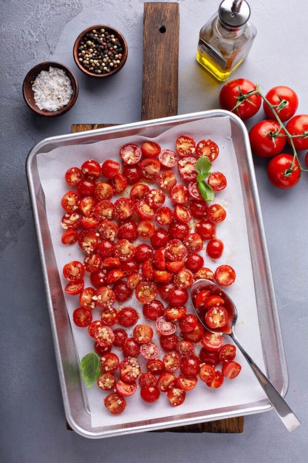 Roasted Garlic Cherry Tomatoes on a large sheet pan.