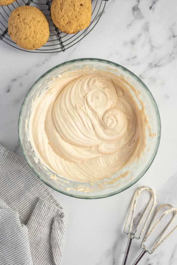 Frosting has been whipped in a large mixing bowl. 