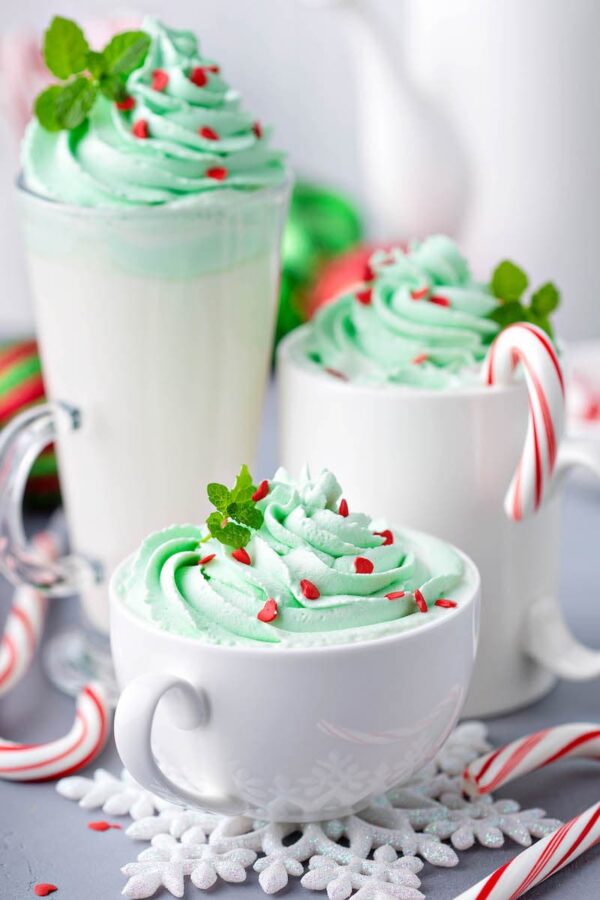 Three Glasses of Peppermint Hot Chocolate of Various Sizes with Mint Leaf Garnishes