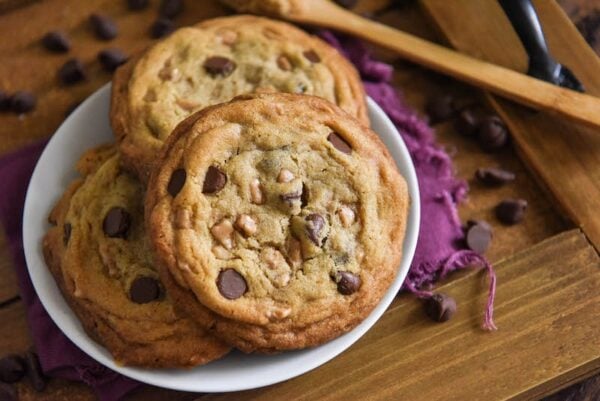 Heath Bar Cookies are a buttery, brown sugar cookie loaded with chocolate chips and toffee bits with thick, chewy centers and crispy edges! #HeathBarCookies #Cookies #HeathBar #Toffee #CookieRecipes