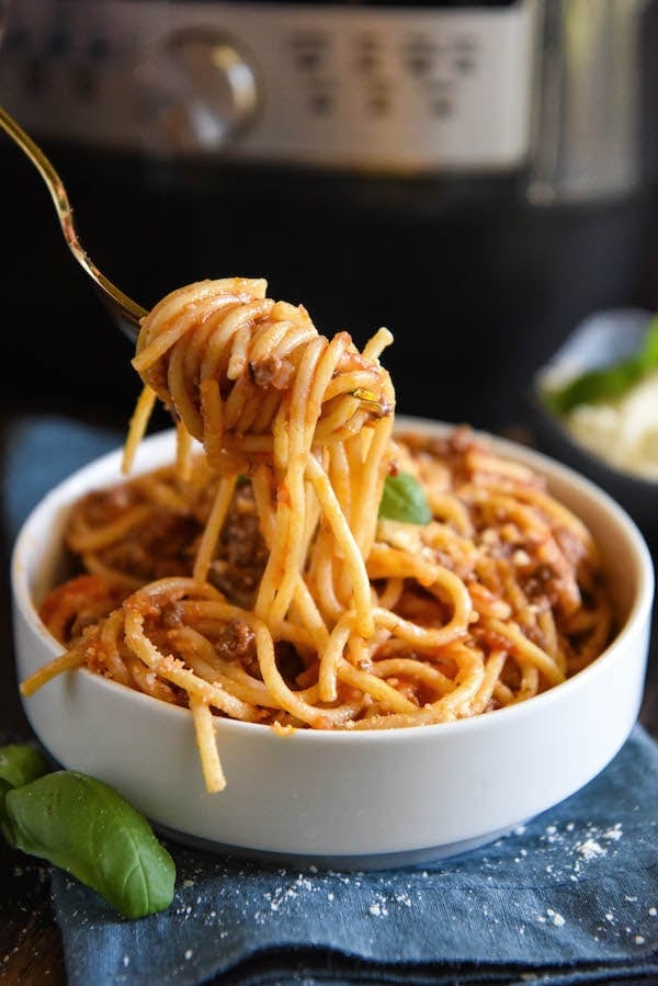 A big forkful of spaghetti bolognese. 