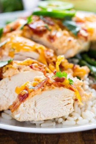 Jalapeno Popper Chicken cut into slices on a plate.