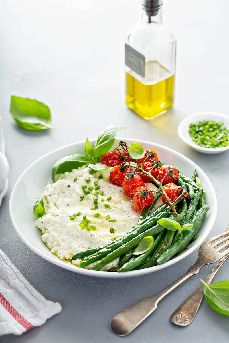 Mashed Cauliflower with roasted green beans and tomatoes.