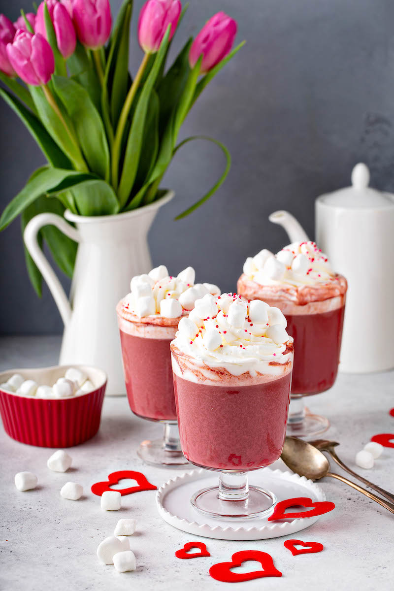 This rich and creamy Red Velvet Hot Chocolate has all the flavors of the classic cake, including a marshmallow whipped cream topping that tastes like frosting! #RedVelvetHotChocolate #RedVelvet #HotChocolate #ValentinesDay #Drink #Dessert