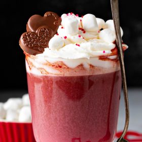 This rich and creamy Red Velvet Hot Chocolate has all the flavors of the classic cake, including a marshmallow whipped cream topping that tastes like frosting! #RedVelvetHotChocolate #RedVelvet #HotChocolate #ValentinesDay #Drink #Dessert