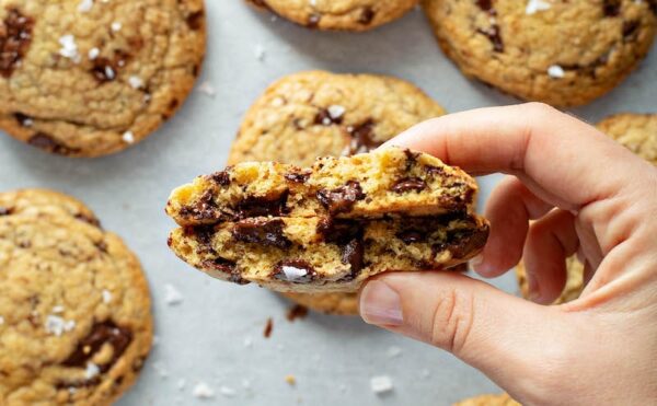 These Chocolate Chunk Cookies are thick, buttery, loaded with chocolate chunks and topped with a sprinkle of sea salt to create your new favorite cookie recipe! #ChocolateChunkCookies #Cookies #CookieRecipes #ChocolateChipCookies #Dessert #Chocolate