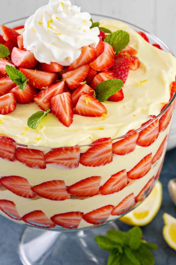 Bands of strawberries with vanilla wafers and creamy lemon pudding layered together. 