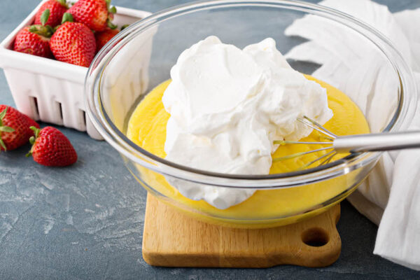 Lemon pudding with fresh whipped cream on top. 