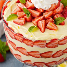 Lemon strawberry trifle with fresh strawberries and whipped cream.