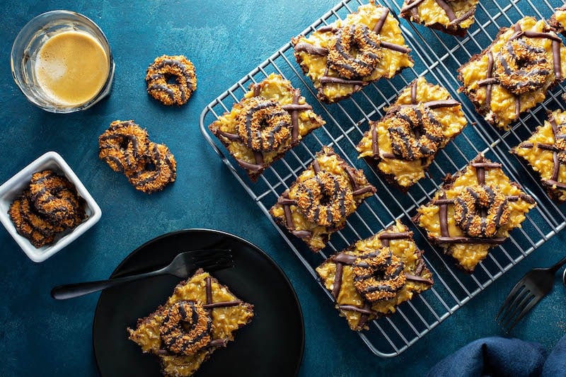 Slices of samoa cookies sheet cake.