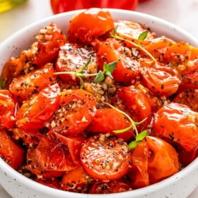 Close-up of roasted cherry tomatoes in a bowl.