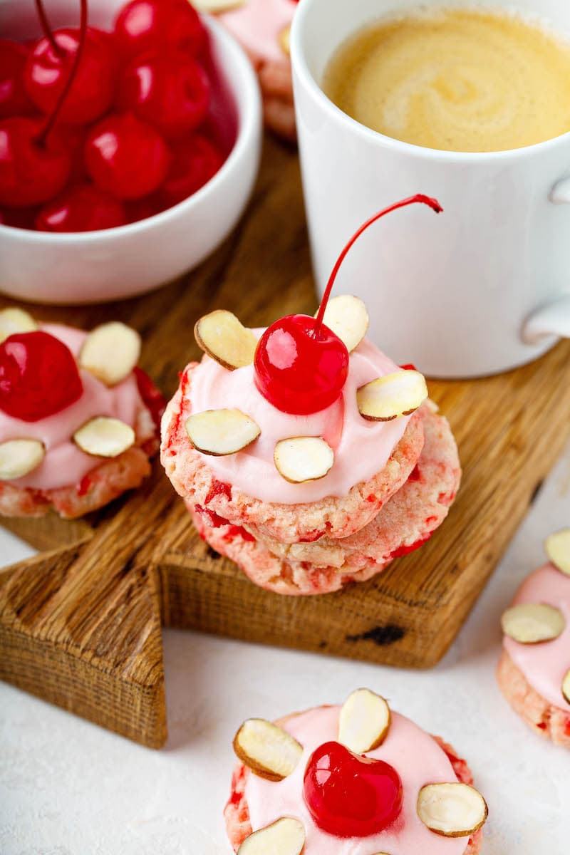 Cherry Almond Sugar Cookies: a buttery thick almond sugar cookie loaded with maraschino cherries with an adorably pink maraschino cherry frosting! #CherryAlmondSugarCookies #SugarCookies #AlmondSugarCookies #CherryAlmond #Dessert #Cookies #CherryCookies #Cherry #MaraschinoCherries