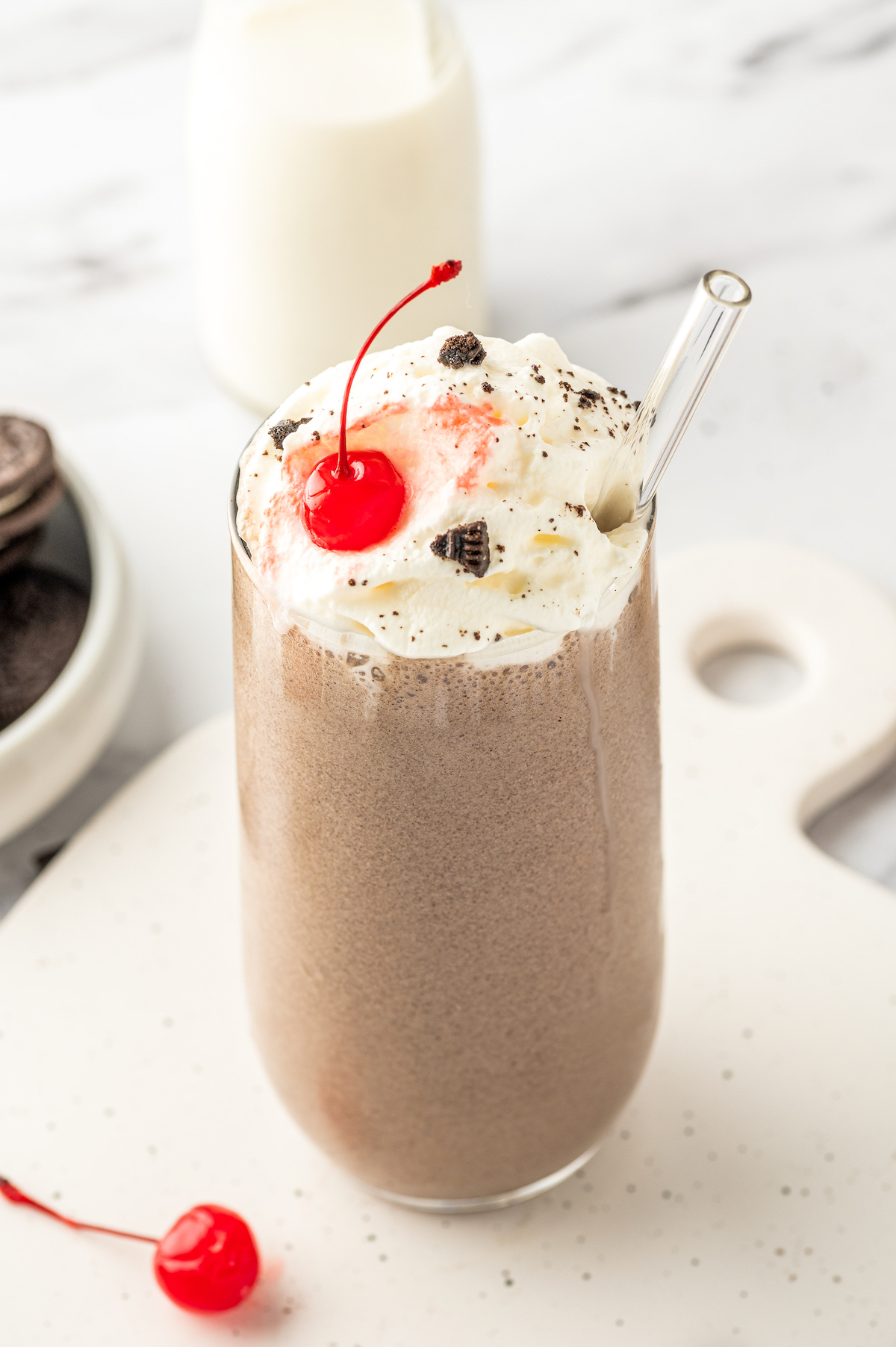 A tall glass of copycat cookies and cream Chick-Fil-A milkshake.