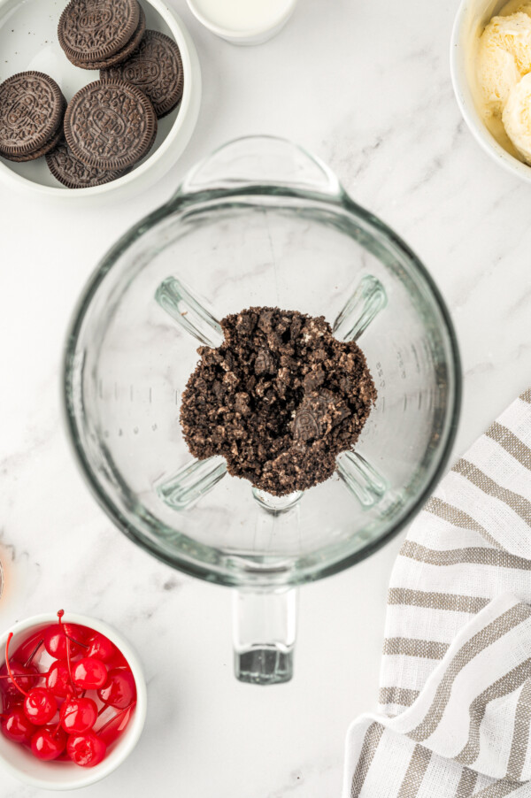 Crushed chocolate sandwich cookies in a blender.