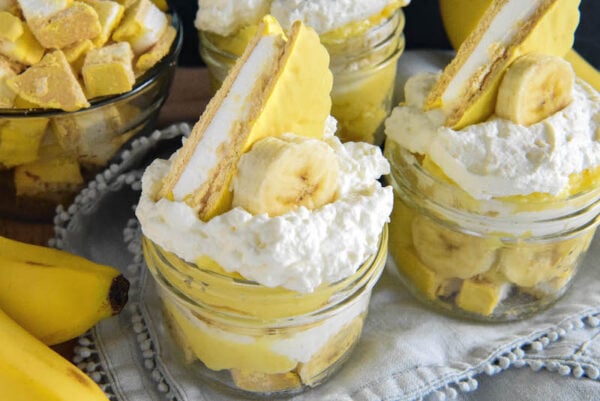 Two mason jars filled with Banana Moon Pie Trifles 