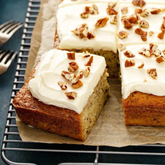 Banana Pecan Cake with a slice cut out of it.