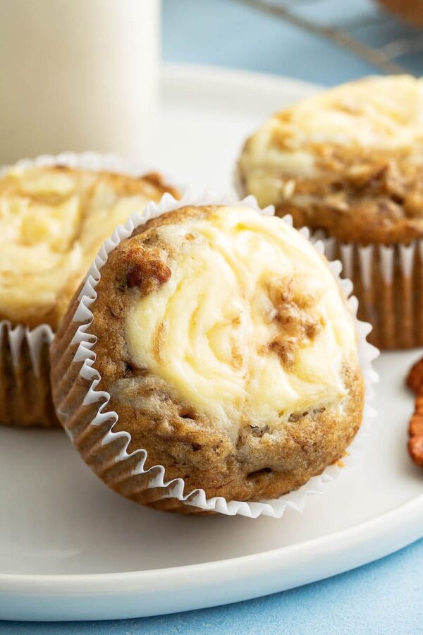 Banana Cream Cheese Muffins on a plate.