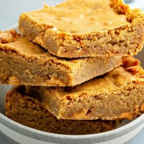 Butterscotch Blondies stacked on top of each other.