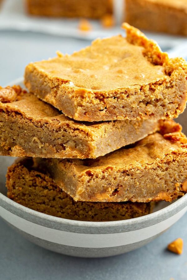 Butterscotch Blondies stacked on top of each other.