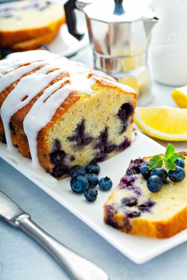 Blueberry Buttermilk Bread sliced on a plate.