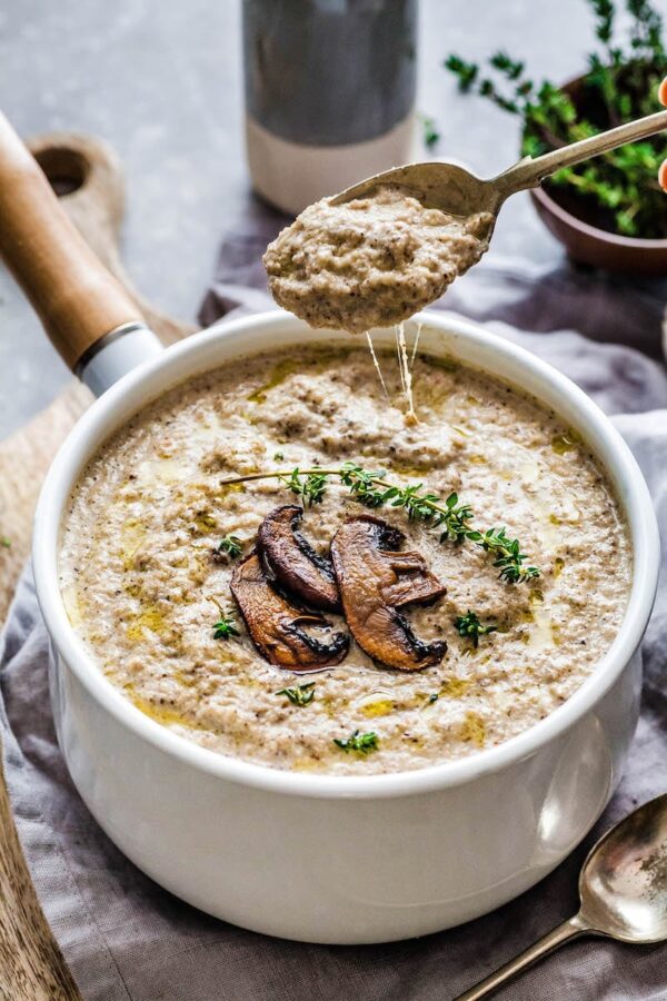 Creamy Roasted Mushroom Soup in a small white crock bowl.
