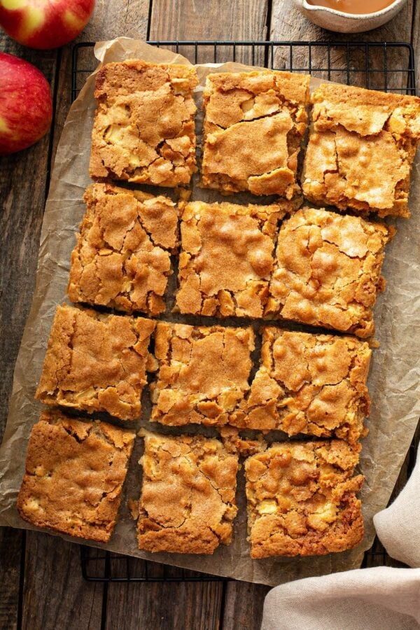 Apple Blondies on parchment paper and cut into squares. 