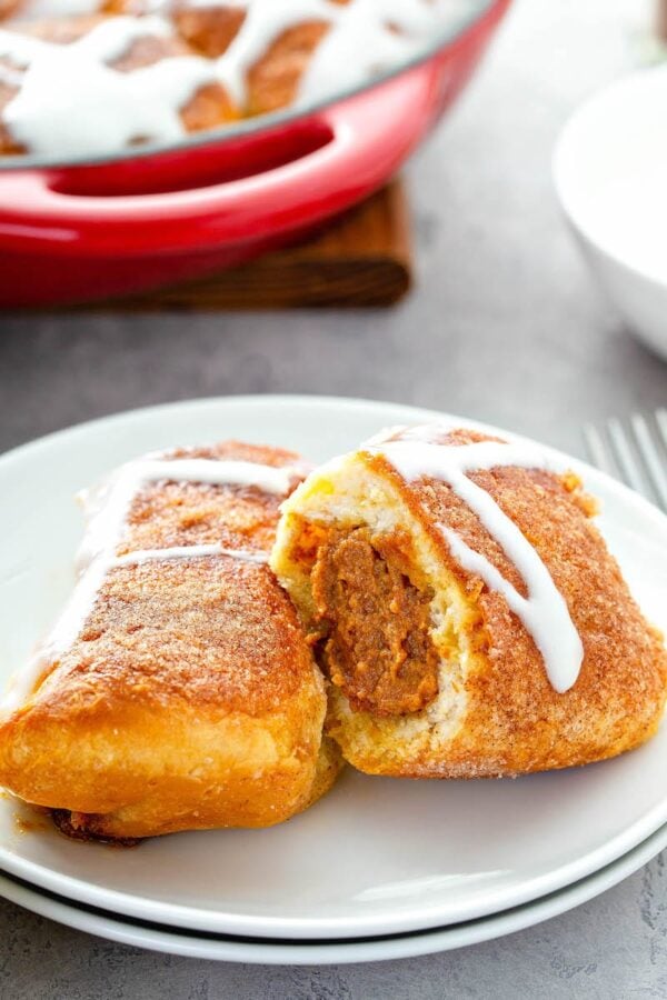 Pumpkin PIe Bombs sliced in half to show the pumpkin filling.