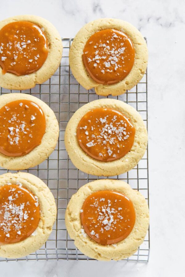 Salted Caramel Cookies on a metal cooling rack.