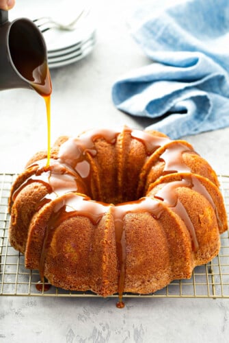 Butterbeer Pound Cake on a cooling rack with butterscotch sauce.