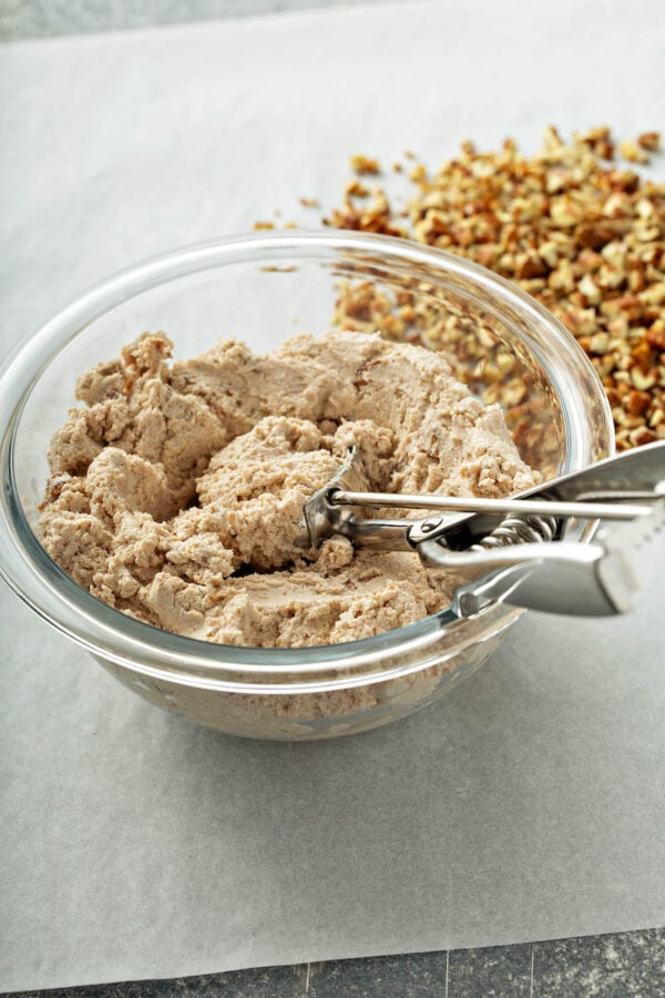 Filling for Honey Pecan Cheese Truffles in a glass bowl for holiday appetizers. 