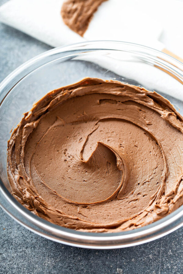 Chocolate Buttercream Icing in a bowl swirled together.