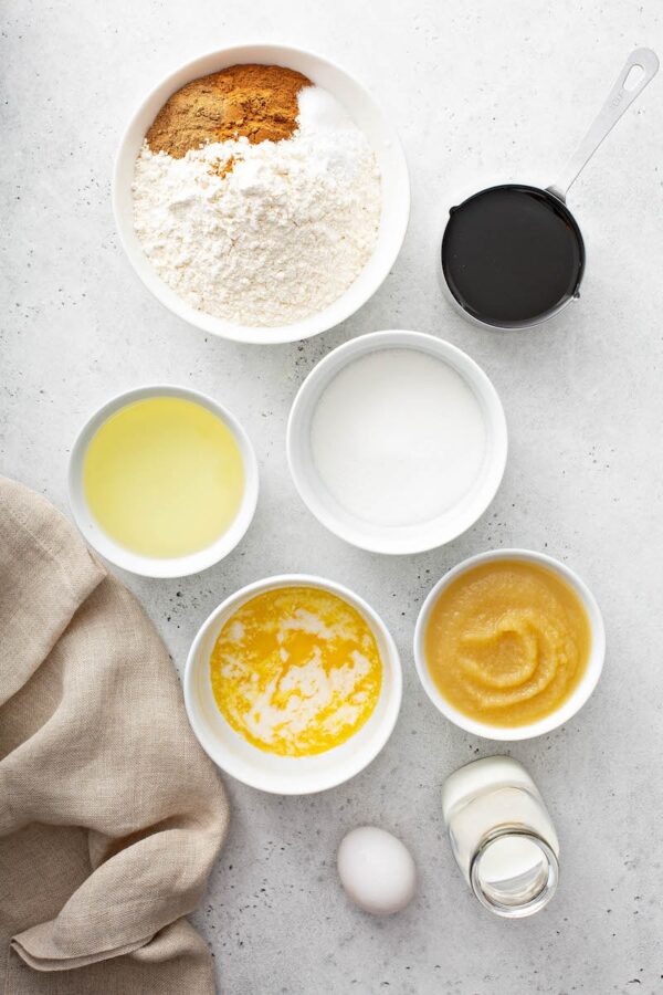 Gingerbread ingredients in white bowls.