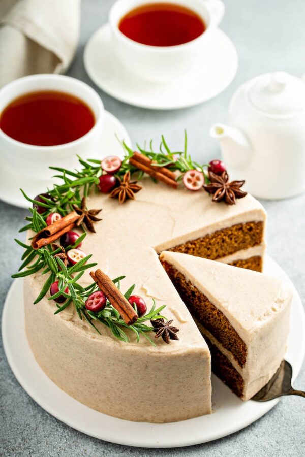 Gingerbread Cake sliced into pieces with two cups of tea.