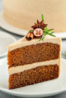 Two layers of homemade gingerbread cake are assembled with thick cinnamon cream cheese frosting.