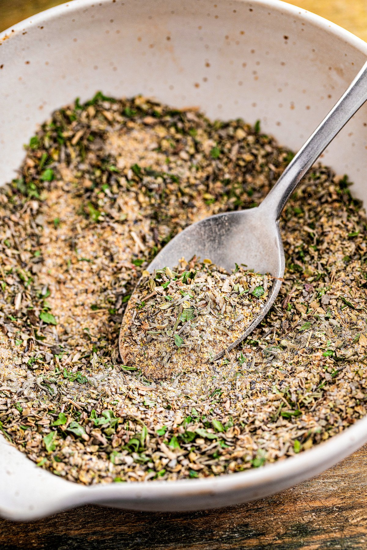 Spoonful of mixed dried herbs.